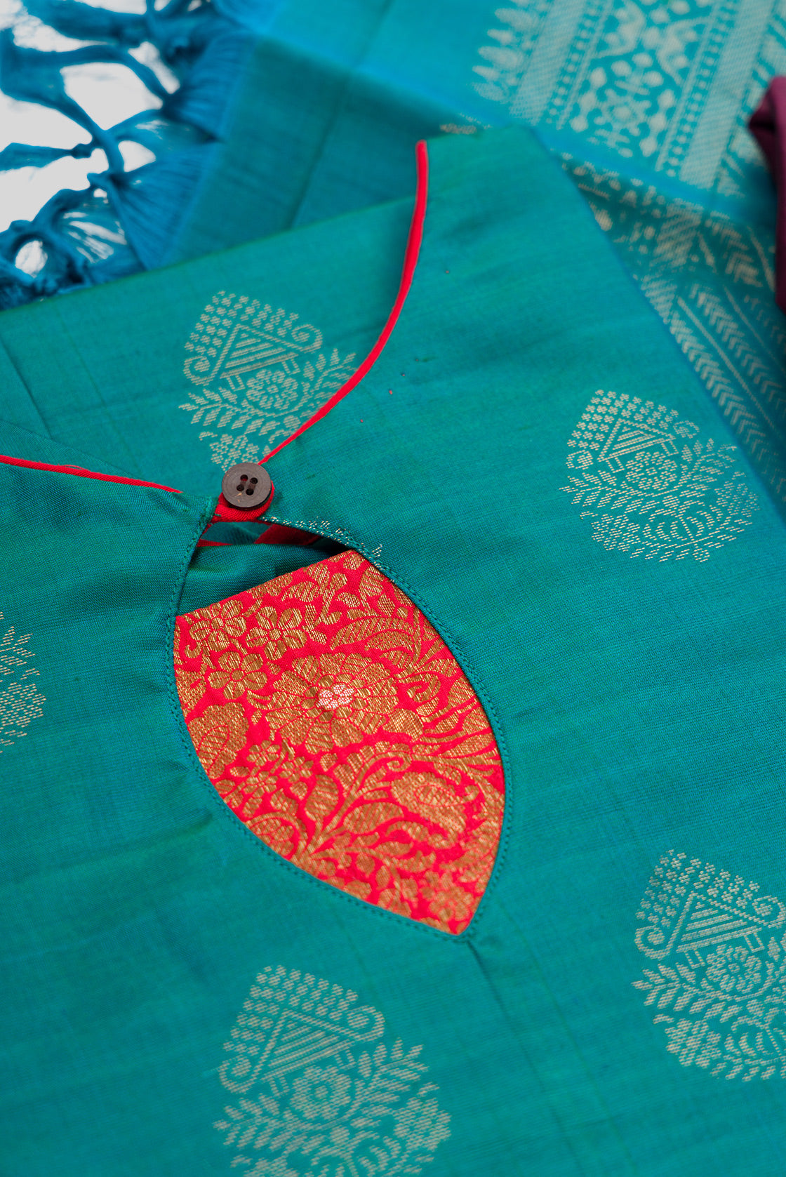 Detailed shot of Green Pure Silk Womens Kurta set featuring Zari Butta Kurta paired with Burgundy Plain Body bottom and a Zari Butta dupatta in Burgundy