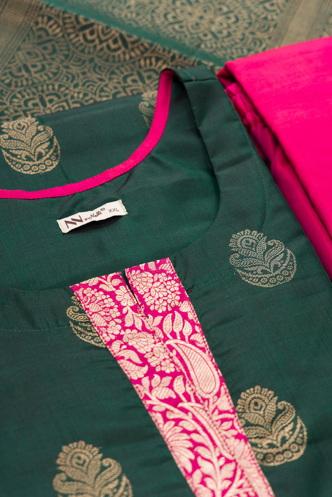 Detailed shot of Green Pure Silk Womens Kurta set featuring Zari Butta Kurta paired with Magenta Plain Body bottom and a Zari Butta dupatta in Magenta