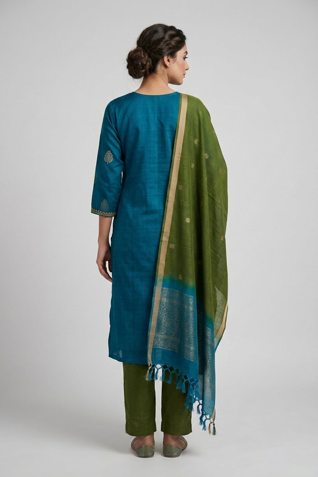 Peacock Blue Pure Silk Womens Kurta set featuring Zari Butta Kurta paired with Green Plain Body bottom and a Zari Butta dupatta in Green back image displayed on an AI model