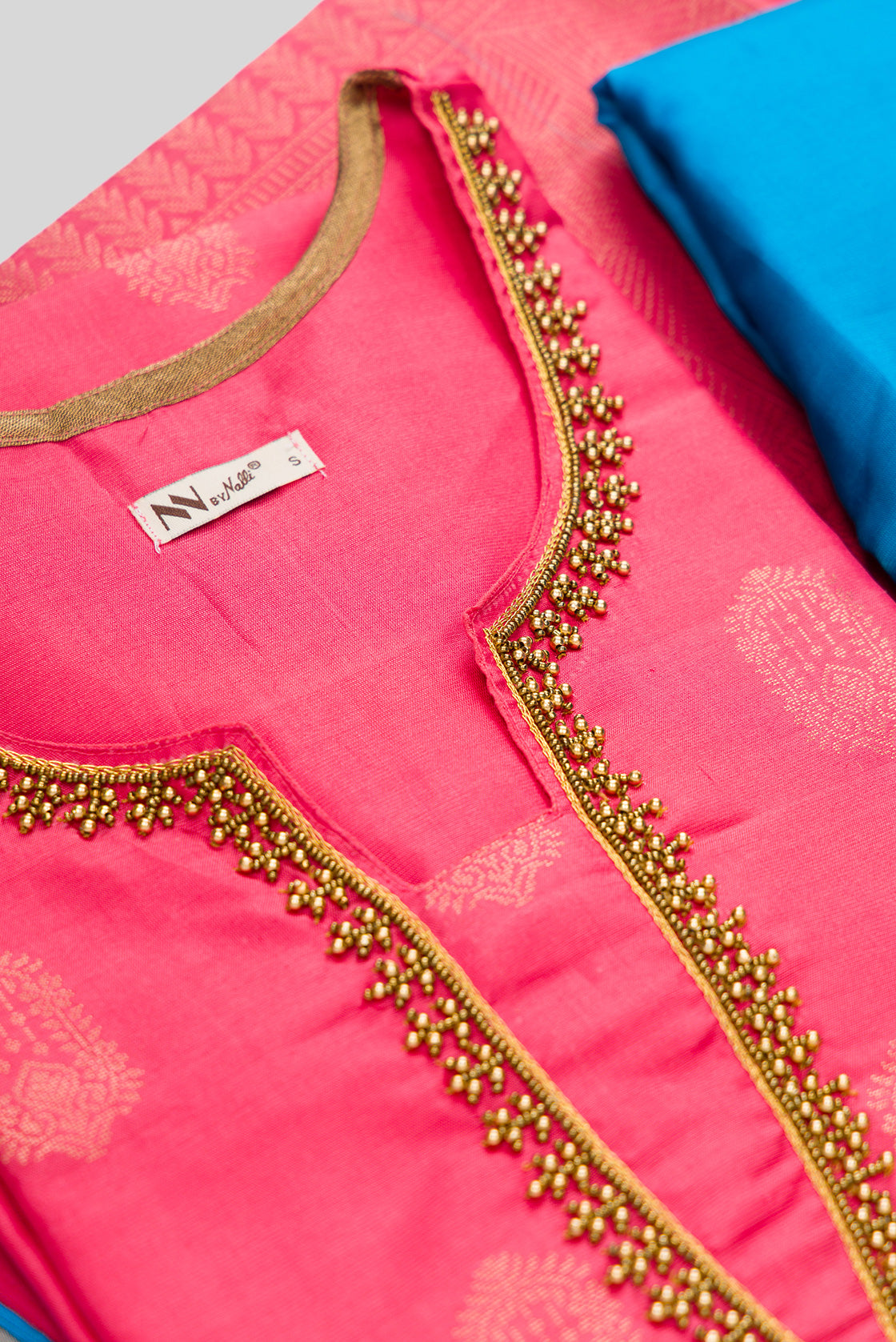 Detailed shot of Rose pink Pure Silk Womens Kurta set featuring Zari Butta Kurta paired with Sky Blue Plain Body bottom and a Zari Butta dupatta in Sky Blue