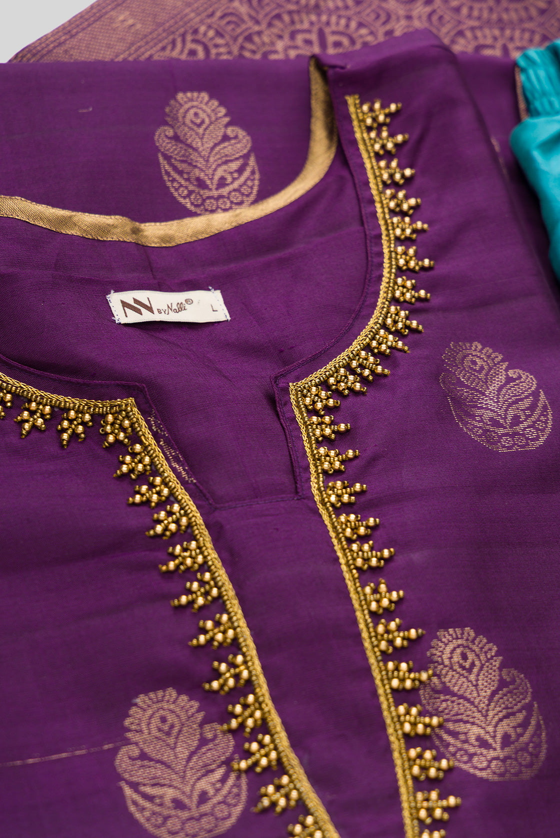 Detailed shot of Violet Pure Silk Womens Kurta set featuring Zari Butta Kurta paired with Sky Blue Plain Body bottom and a Zari Butta dupatta in Sky Blue