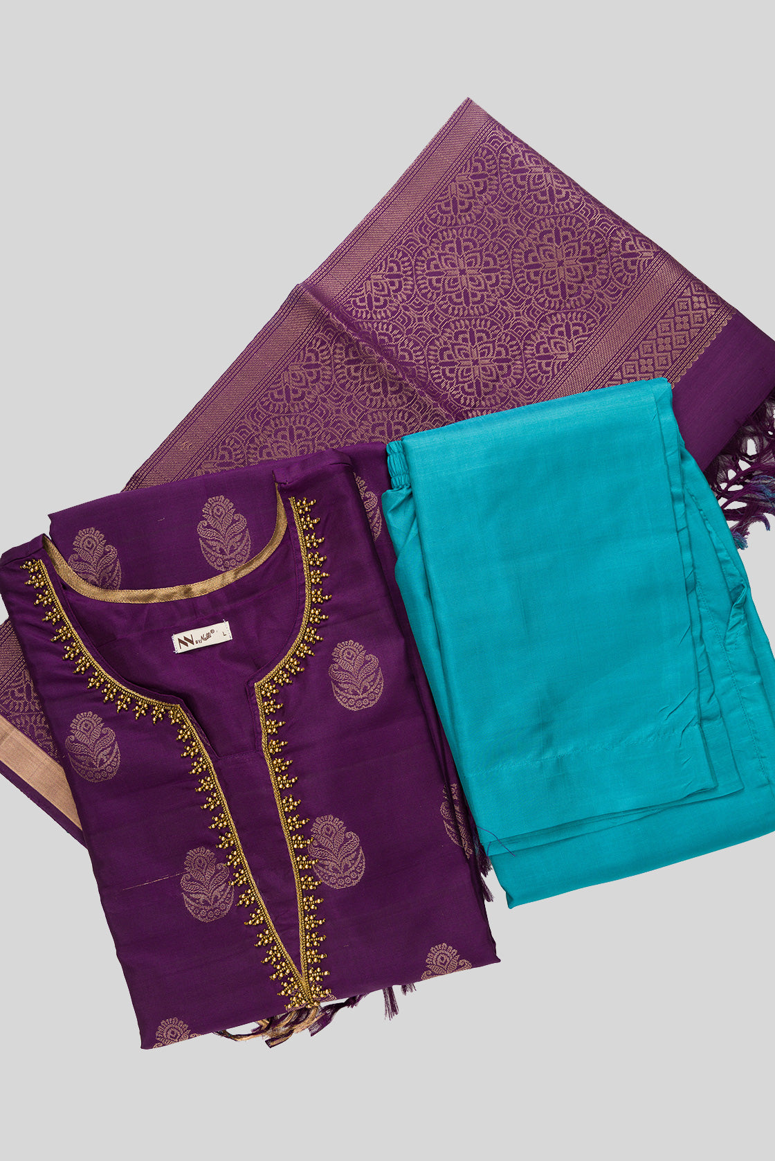 Flat lay of Violet Pure Silk Womens Kurta set featuring Zari Butta Kurta paired with Sky Blue Plain Body bottom and a Zari Butta dupatta in Sky Blue