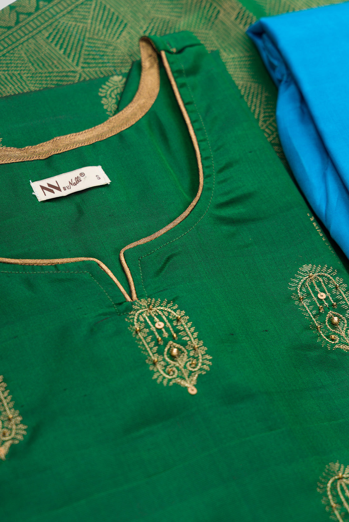 Detailed shot of Green Pure Silk Womens Kurta set featuring Embroidery Kurta paired with Sky Blue Plain Body bottom and a Zari Butta dupatta in Sky Blue