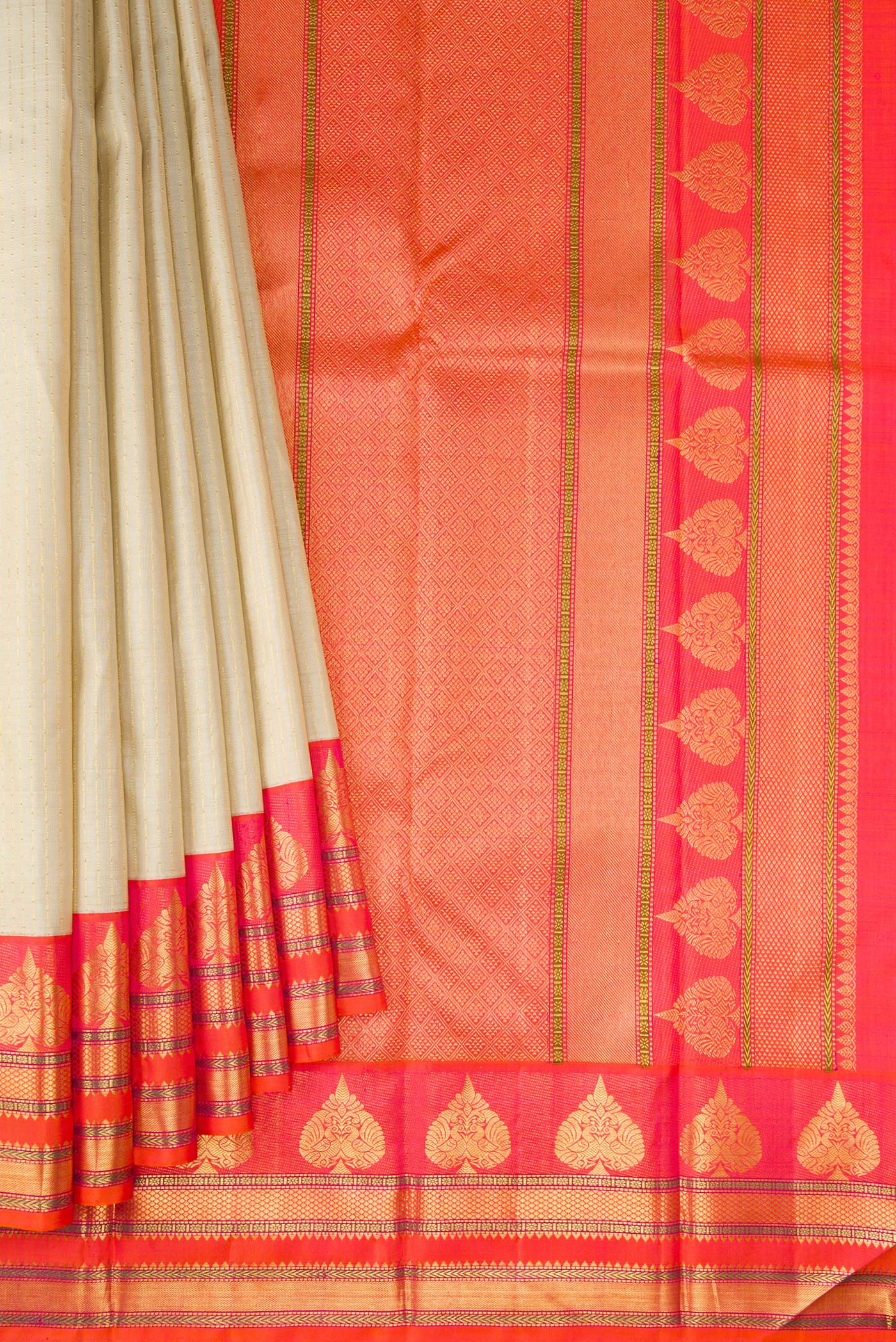Pleats and pallu of Beige Dual Tone Kanchipuram Silk Saree with Stripes on the body and Fancy Border. 