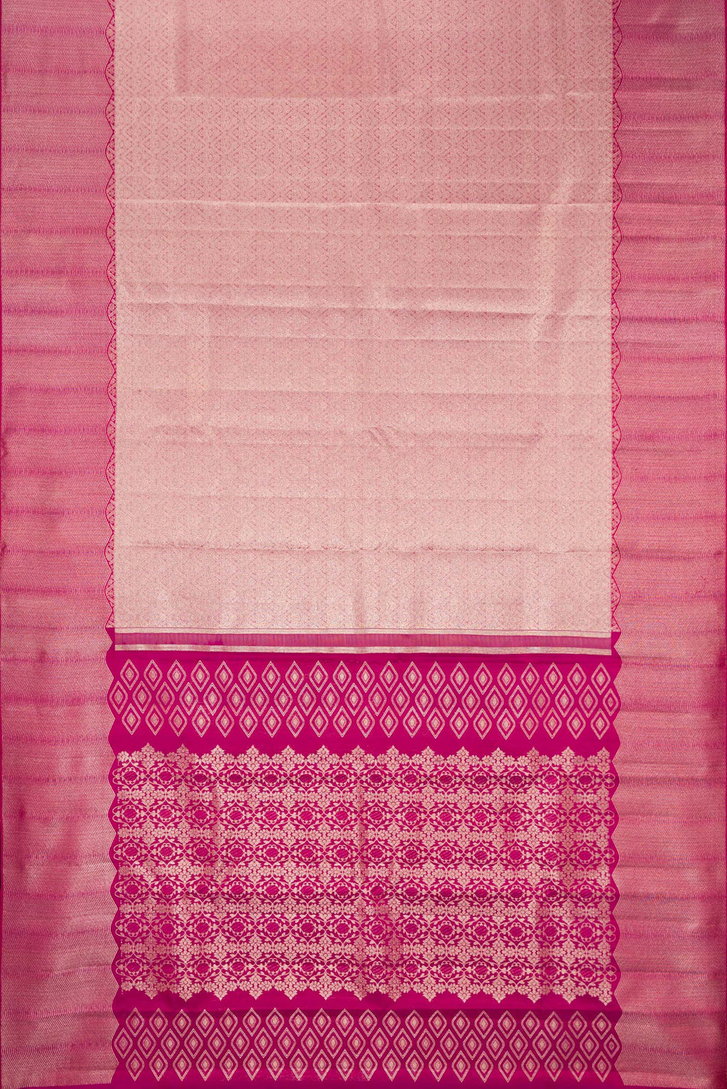 Flat view of Rose Gold Kanchipuram Silk Saree with Zari Brocade on the body and Zari Border. 