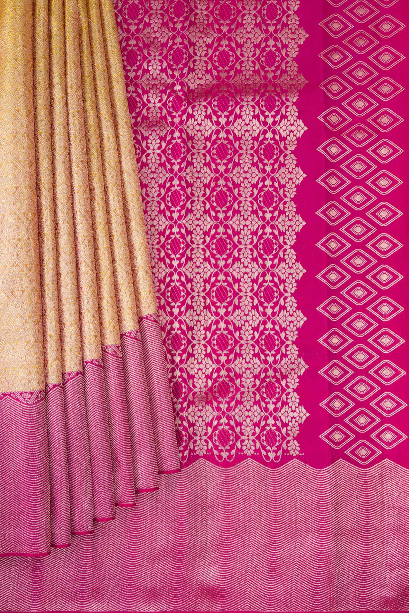 Pleats and pallu of Gold Kanchipuram Silk Saree with Zari Brocade on the body and Zari Border. 