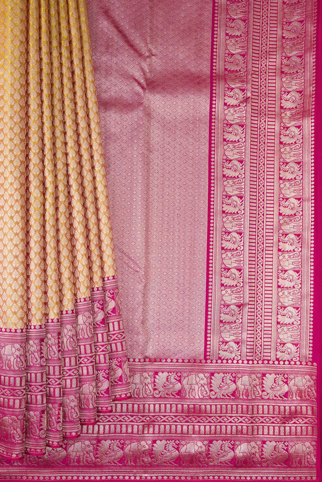 Pleats and pallu of Sandal Kanchipuram Silk Saree with Zari Brocade on the body and Fancy Border. 