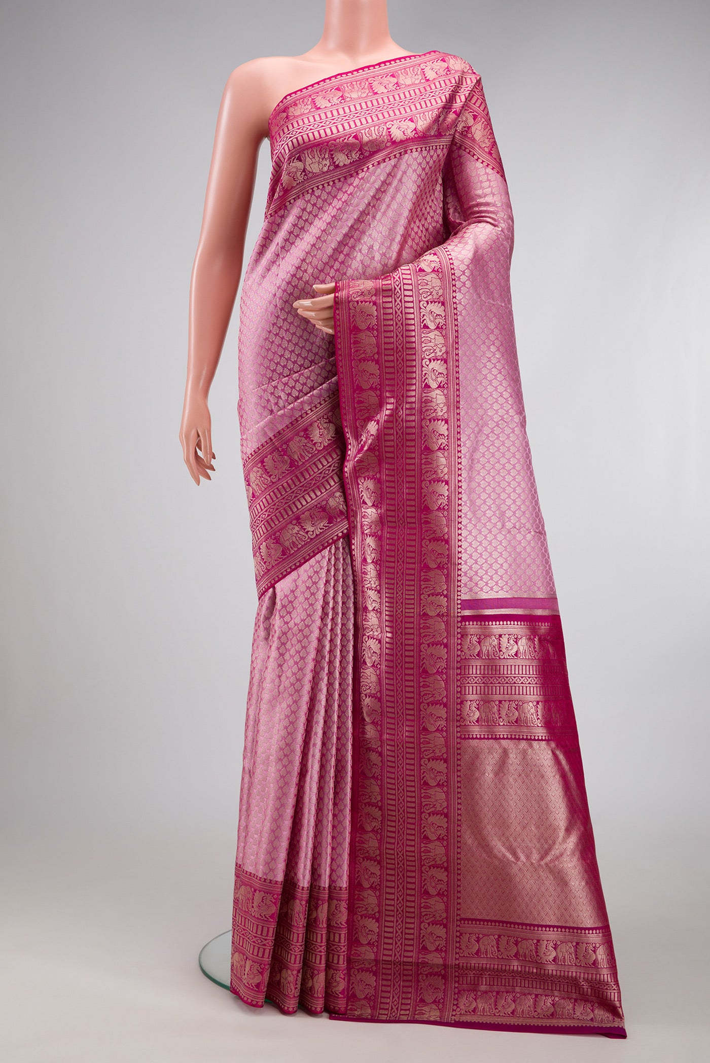 Pink Kanchipuram Silk Saree with Zari Brocade on the body and Fancy Border.  displayed on a mannequin