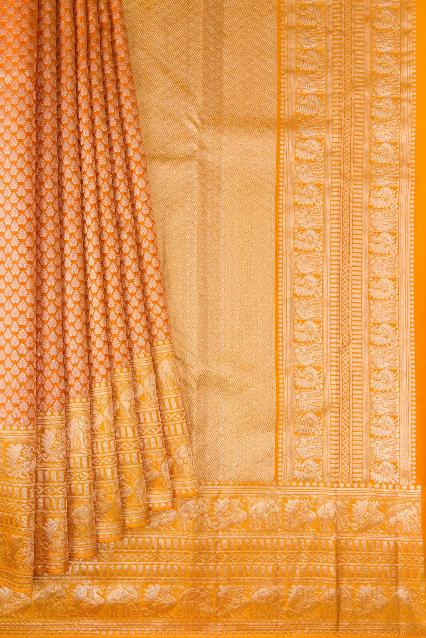 Pleats and pallu of Orange Kanchipuram Tissue Silk Saree with Zari Brocade on the body and Fancy Border. 