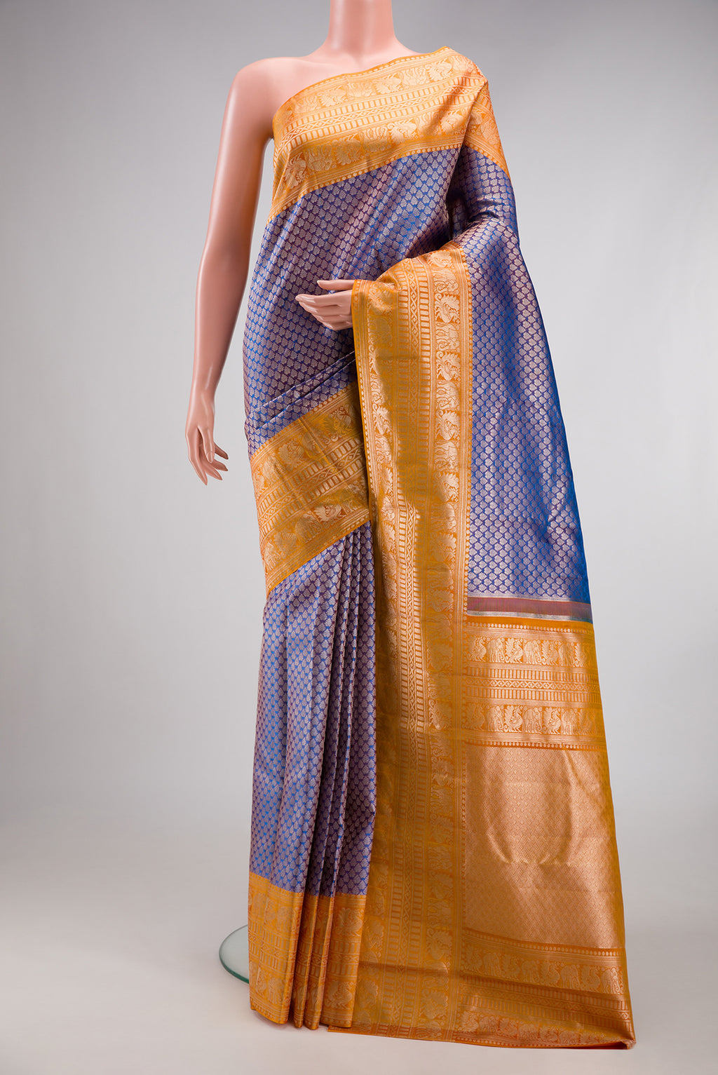 Purple Dual Tone Kanchipuram Tissue Silk Saree with Zari Brocade on the body and Fancy Border.  displayed on a mannequin