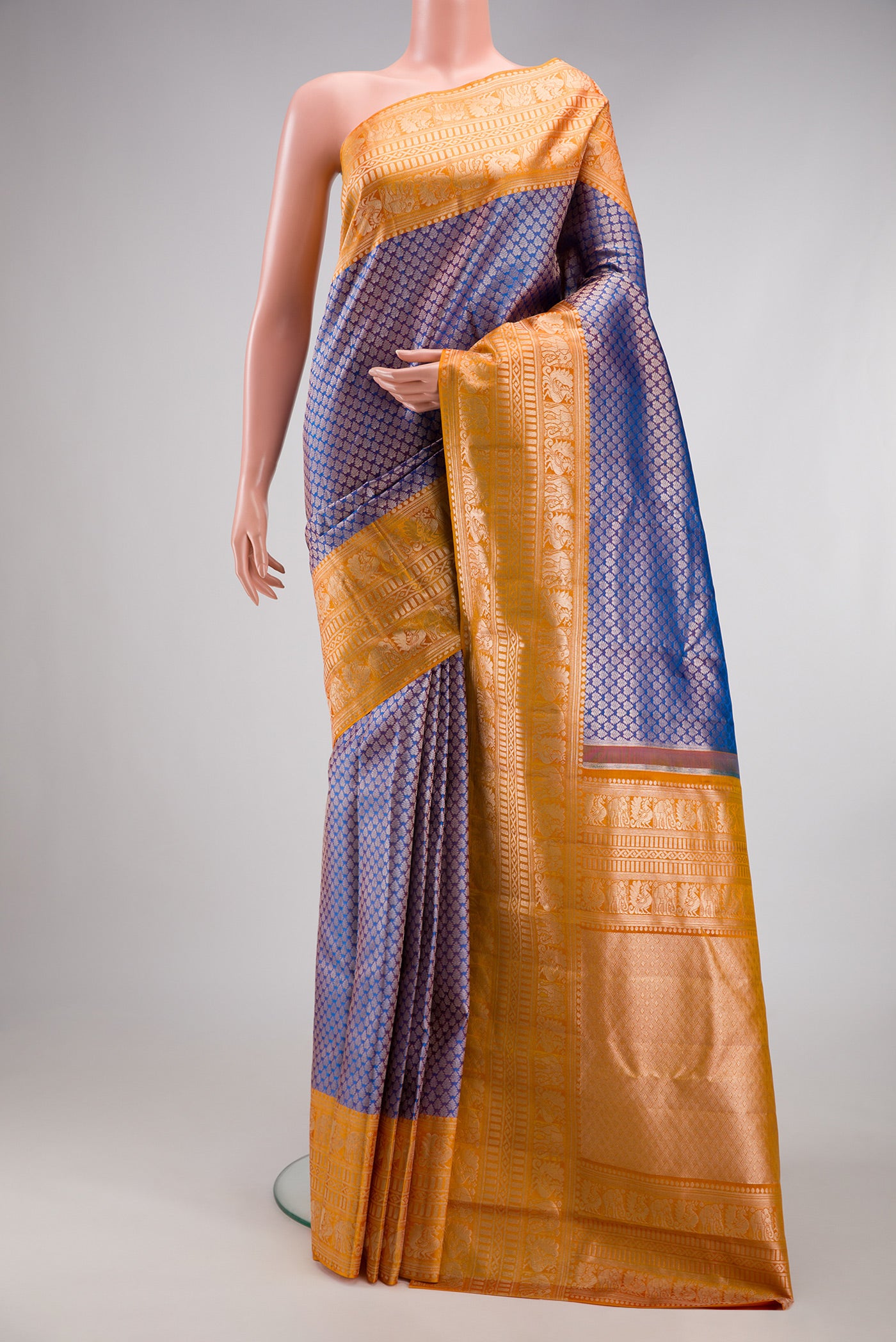 Purple Dual Tone Kanchipuram Tissue Silk Saree with Zari Brocade on the body and Fancy Border.  displayed on a mannequin