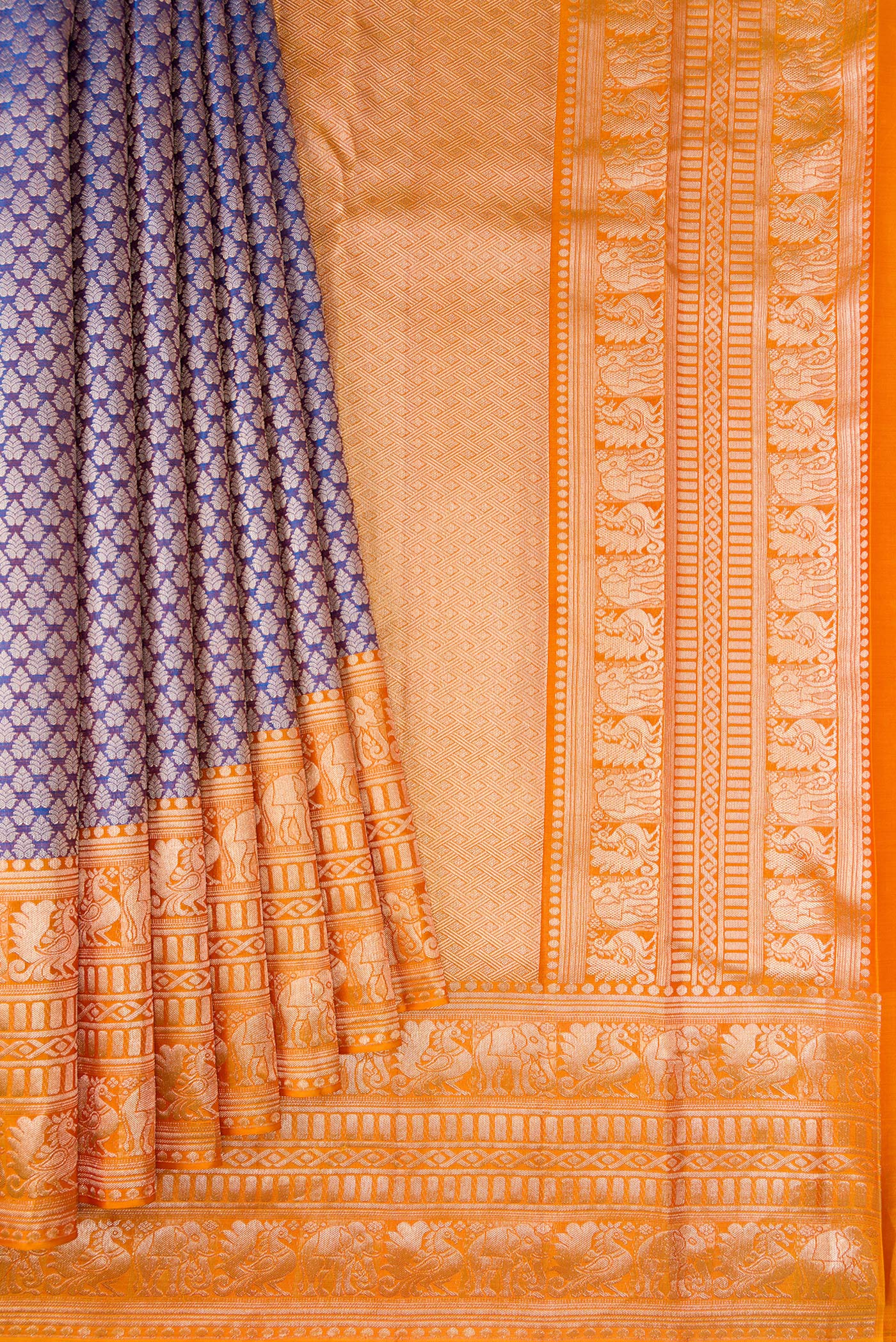Pleats and pallu of Purple Dual Tone Kanchipuram Tissue Silk Saree with Zari Brocade on the body and Fancy Border. 