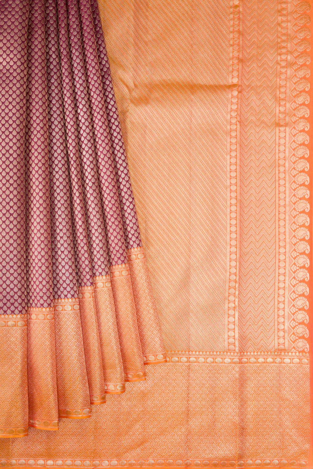 Pleats and pallu of Maroon Dual Tone Kanchipuram Tissue Silk Saree with Zari Brocade on the body and Fancy Border. 