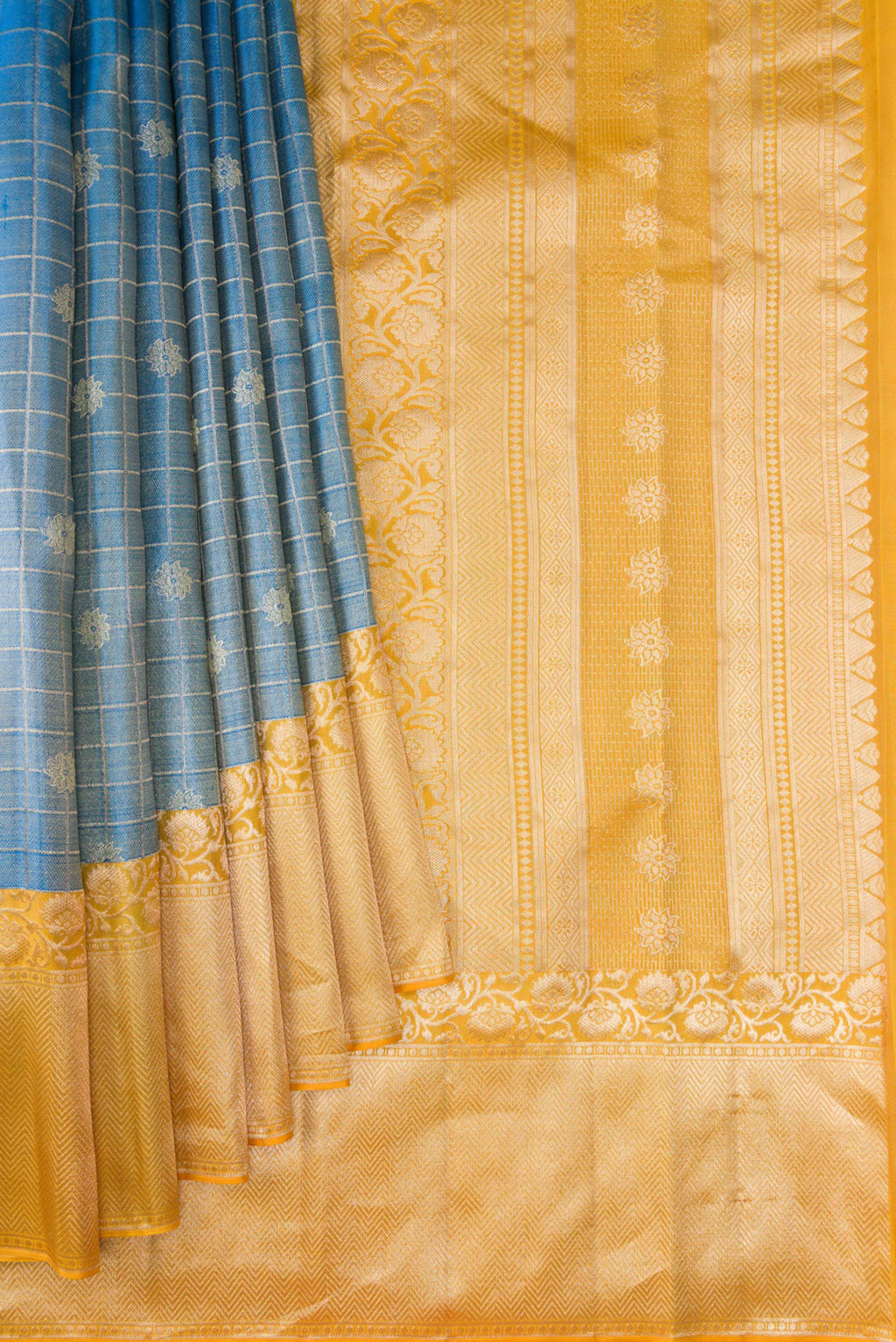 Pleats and pallu of Light Blue Kanchipuram Tissue Silk Saree with Zari Brocade on the body and Fancy Border. 