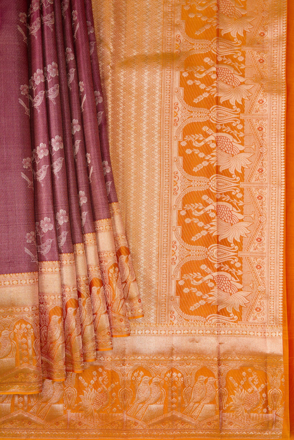 Pleats and pallu of Maroon Dual Tone Kanchipuram Tissue Silk Saree with Zari Brocade on the body and Fancy Border. 