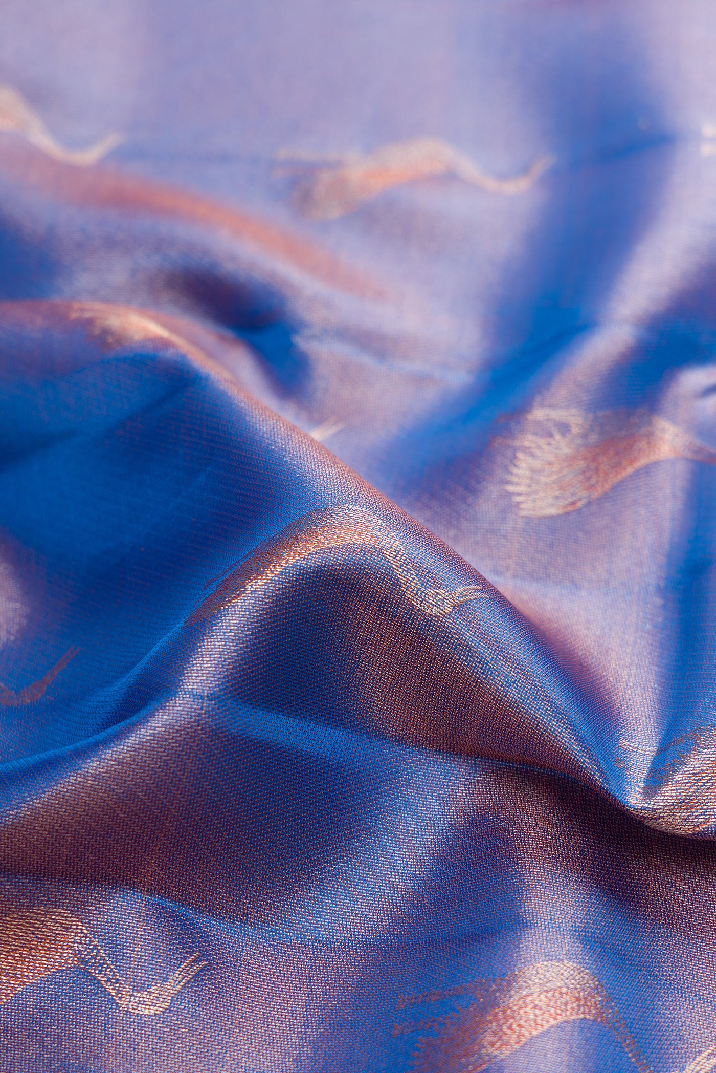 Close up of Blue Kanchipuram Tissue Silk Saree with Zari Brocade on the body and Fancy Border.  displaying folds