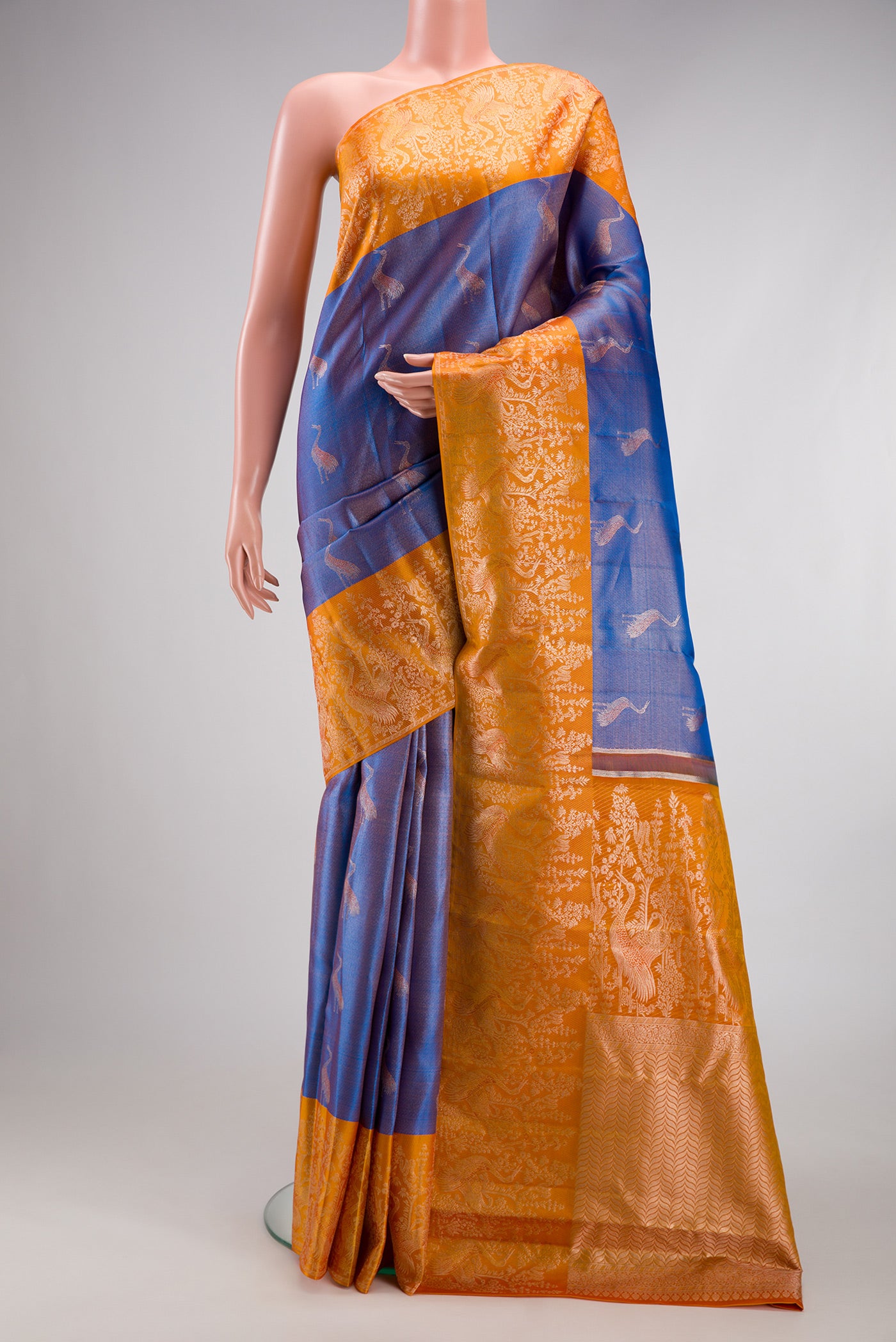 Blue Kanchipuram Tissue Silk Saree with Zari Brocade on the body and Fancy Border.  displayed on a mannequin