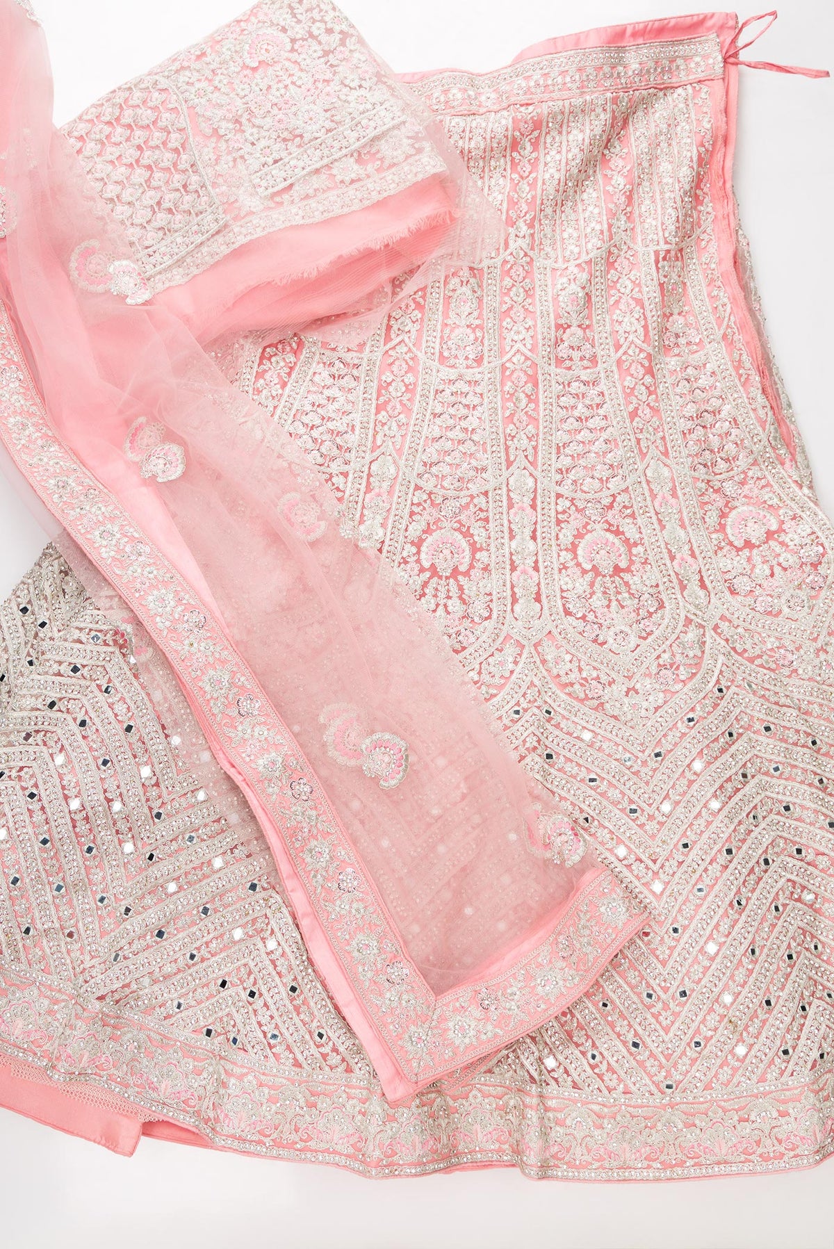Flat lay of Pink Banarasi Silk Womens Lehenga set featuring Embroidered Choli paired with Pink Embroidered Skirt with Embroidered Border and a Embroidered dupatta in Pink