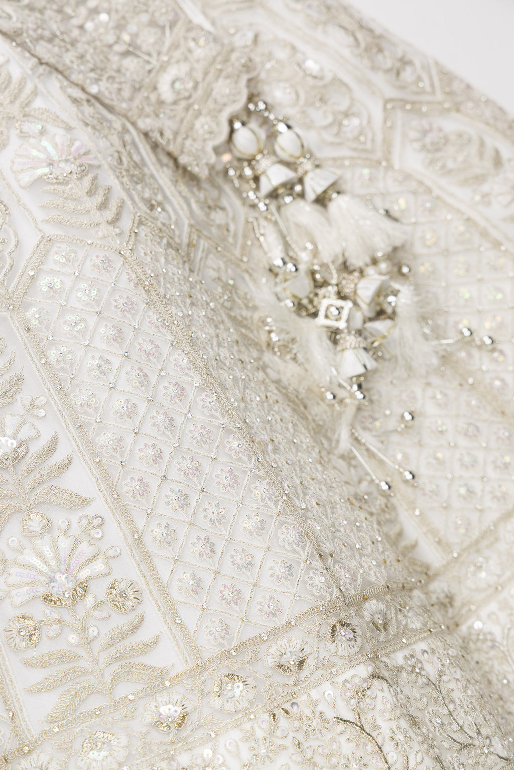 Detailed shot of Off White Banarasi Silk Womens Lehenga set featuring Embroidered Choli paired with Off White Embroidered Skirt with Embroidered Border and a Embroidered dupatta in Off White