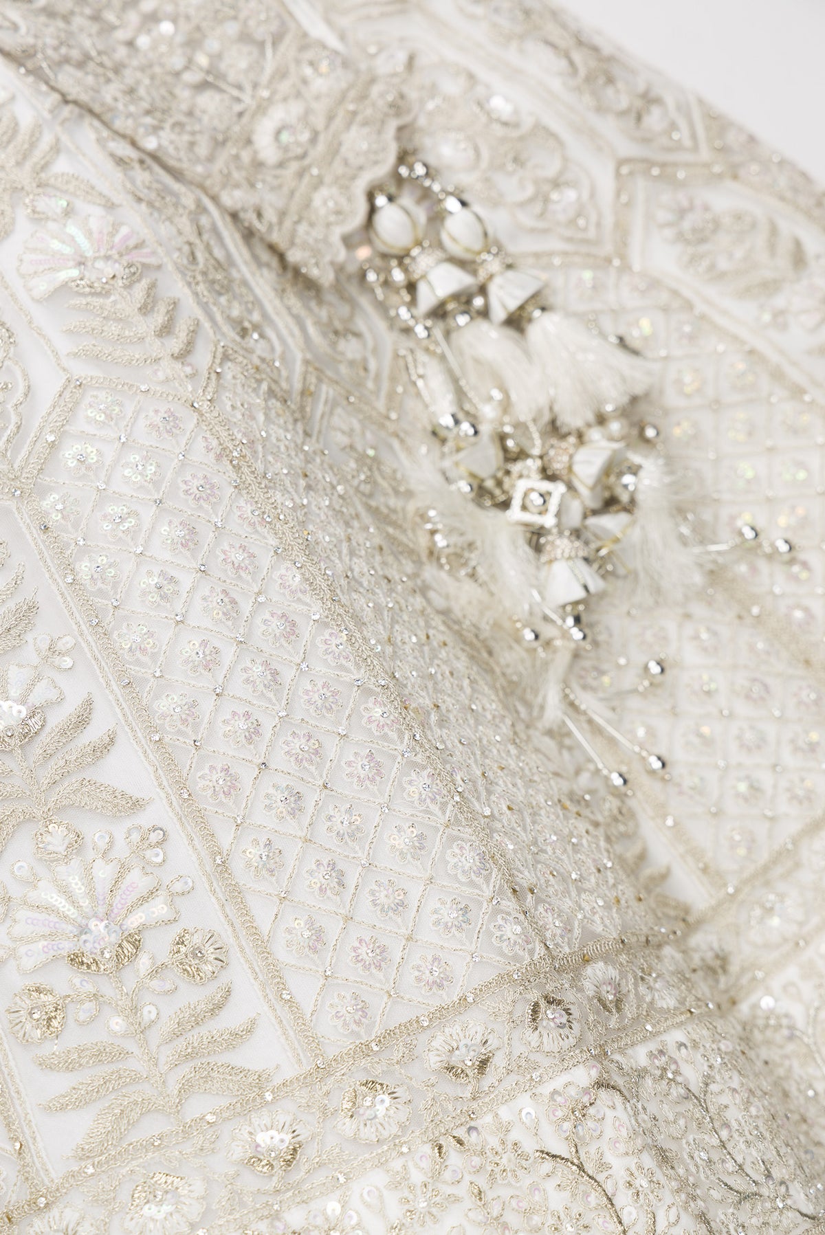 Detailed shot of Off White Banarasi Silk Womens Lehenga set featuring Embroidered Choli paired with Off White Embroidered Skirt with Embroidered Border and a Embroidered dupatta in Off White