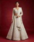Off White Banarasi Silk Womens Lehenga set featuring Embroidered Choli paired with Off White Embroidered Skirt with Embroidered Border and a Embroidered dupatta in Off White