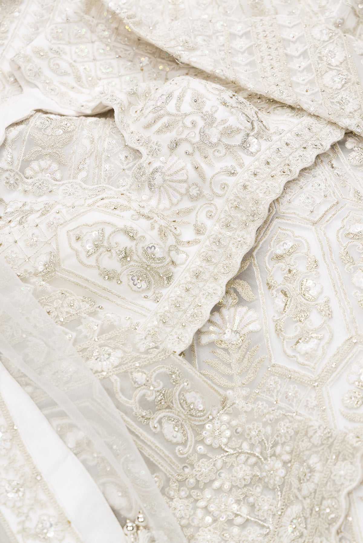 Close up blouse image of Off White Banarasi Silk Womens Lehenga set featuring Embroidered Choli paired with Off White Embroidered Skirt with Embroidered Border and a Embroidered dupatta in Off White