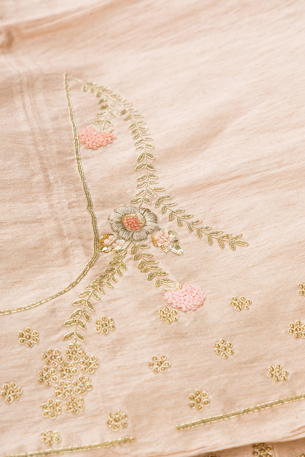 Close up blouse image of Rose Gold Banarasi Silk Womens Lehenga set featuring Embroidered Choli paired with Rose Gold Embroidered Skirt with Embroidered Border and a Embroidered dupatta in Rose Gold