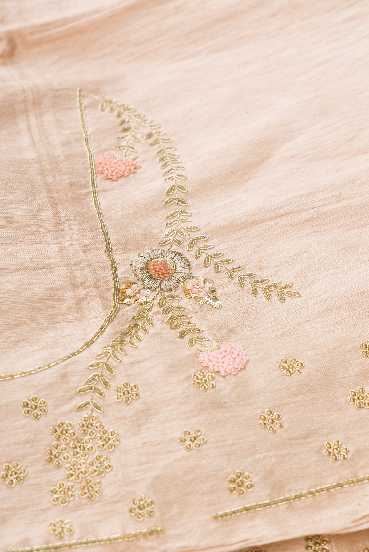Close up blouse image of Rose Gold Banarasi Silk Womens Lehenga set featuring Embroidered Choli paired with Rose Gold Embroidered Skirt with Embroidered Border and a Embroidered dupatta in Rose Gold