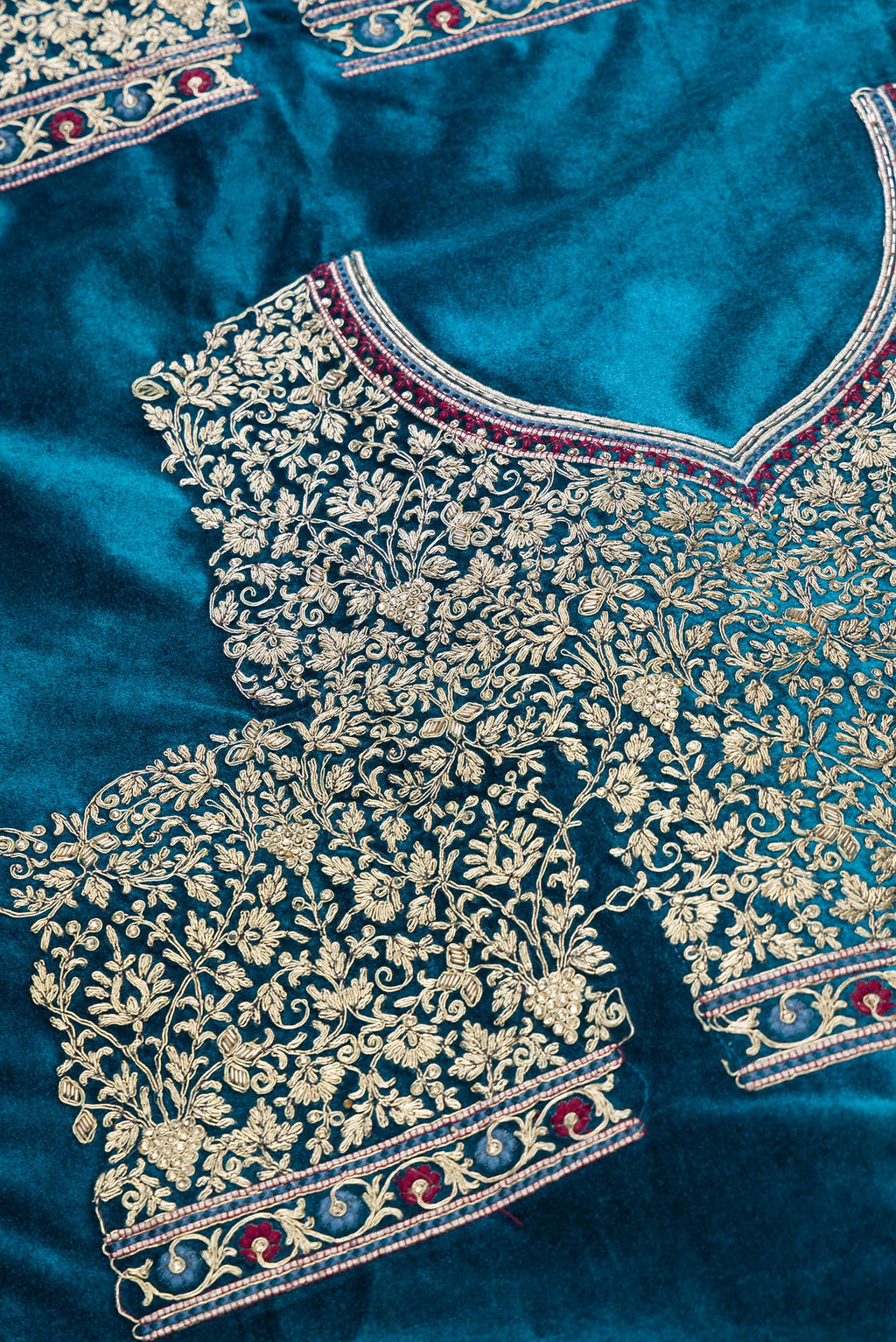 Close up blouse image of Peacock Blue Banarasi Silk Womens Lehenga set featuring Embroidered Choli paired with Peacock Blue Embroidered Skirt with Embroidered Border and a Embroidered dupatta in Pink
