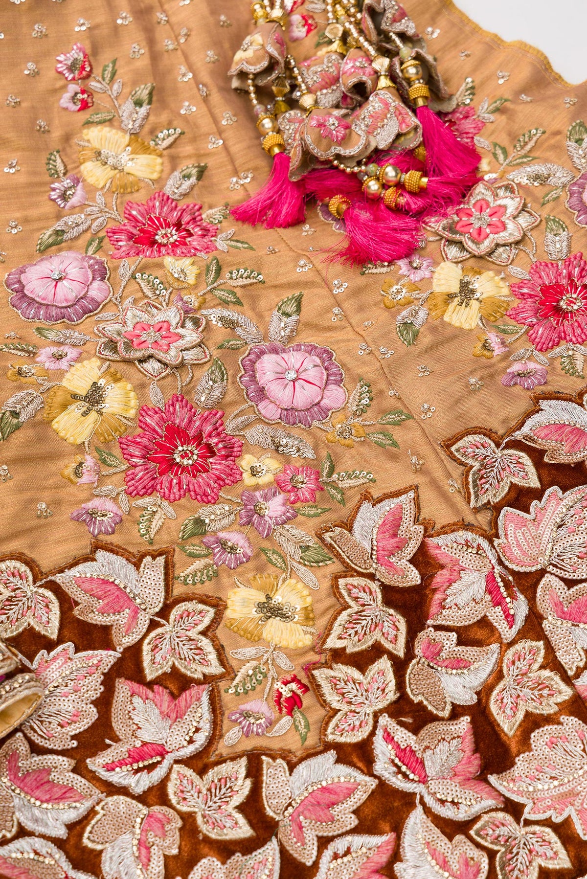 Detailed shot of Golden Peach Banarasi Silk Womens Lehenga set featuring Embroidered Choli paired with Golden Peach Embroidered Skirt with Embroidered Border and a Embroidered dupatta in Golden Peach