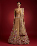 Golden Peach Banarasi Silk Womens Lehenga set featuring Embroidered Choli paired with Golden Peach Embroidered Skirt with Embroidered Border and a Embroidered dupatta in Golden Peach