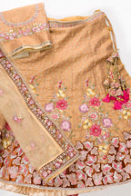 Flat lay of Golden Peach Banarasi Silk Womens Lehenga set featuring Embroidered Choli paired with Golden Peach Embroidered Skirt with Embroidered Border and a Embroidered dupatta in Golden Peach
