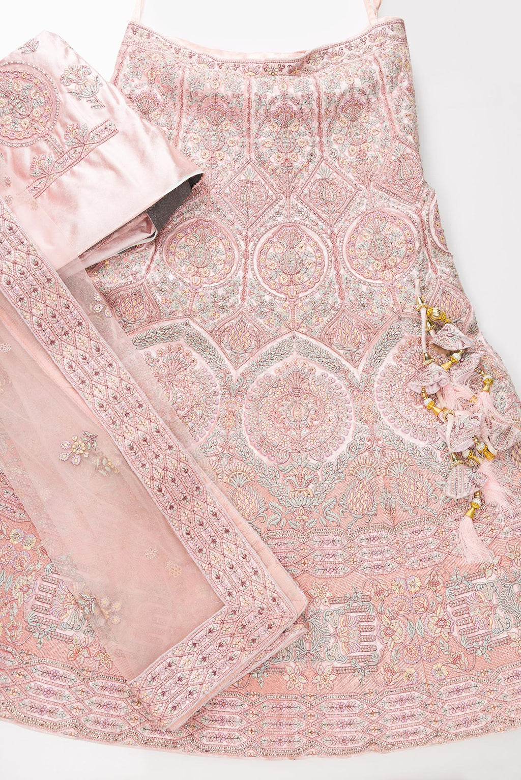 Flat lay of Pink Banarasi Silk Womens Lehenga set featuring Embroidered Choli paired with Pink Embroidered Skirt with Embroidered Border and a Embroidered dupatta in Pink