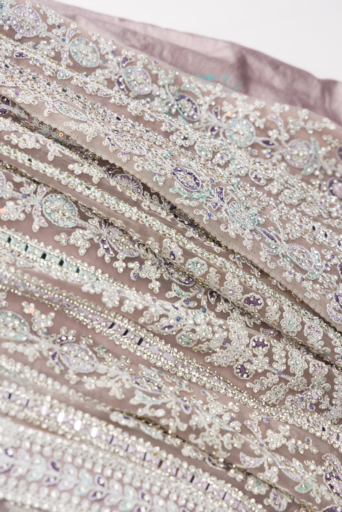 Detailed shot of Lilac Banarasi Silk Womens Lehenga set featuring Embroidered Choli paired with Lilac Embroidered Skirt with Embroidered Border and a Embroidered dupatta in Lilac