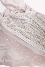 Flat lay of Lilac Banarasi Silk Womens Lehenga set featuring Embroidered Choli paired with Lilac Embroidered Skirt with Embroidered Border and a Embroidered dupatta in Lilac