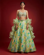 Green Banarasi Silk Womens Lehenga set featuring Embroidered Choli paired with Green Embroidered Skirt with Embroidered Border and a Embroidered dupatta in Green