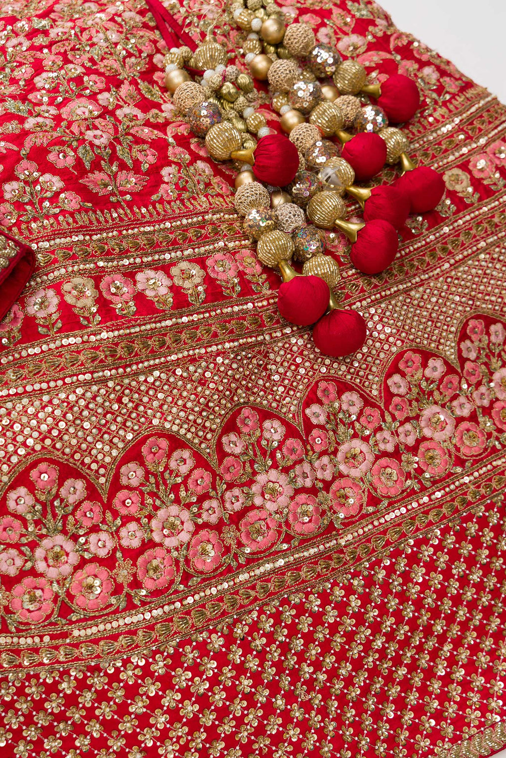 Detailed shot of Red Banarasi Silk Womens Lehenga set featuring Embroidered Choli paired with Red Embroidered Skirt with Embroidered Border and a Embroidered dupatta in Red