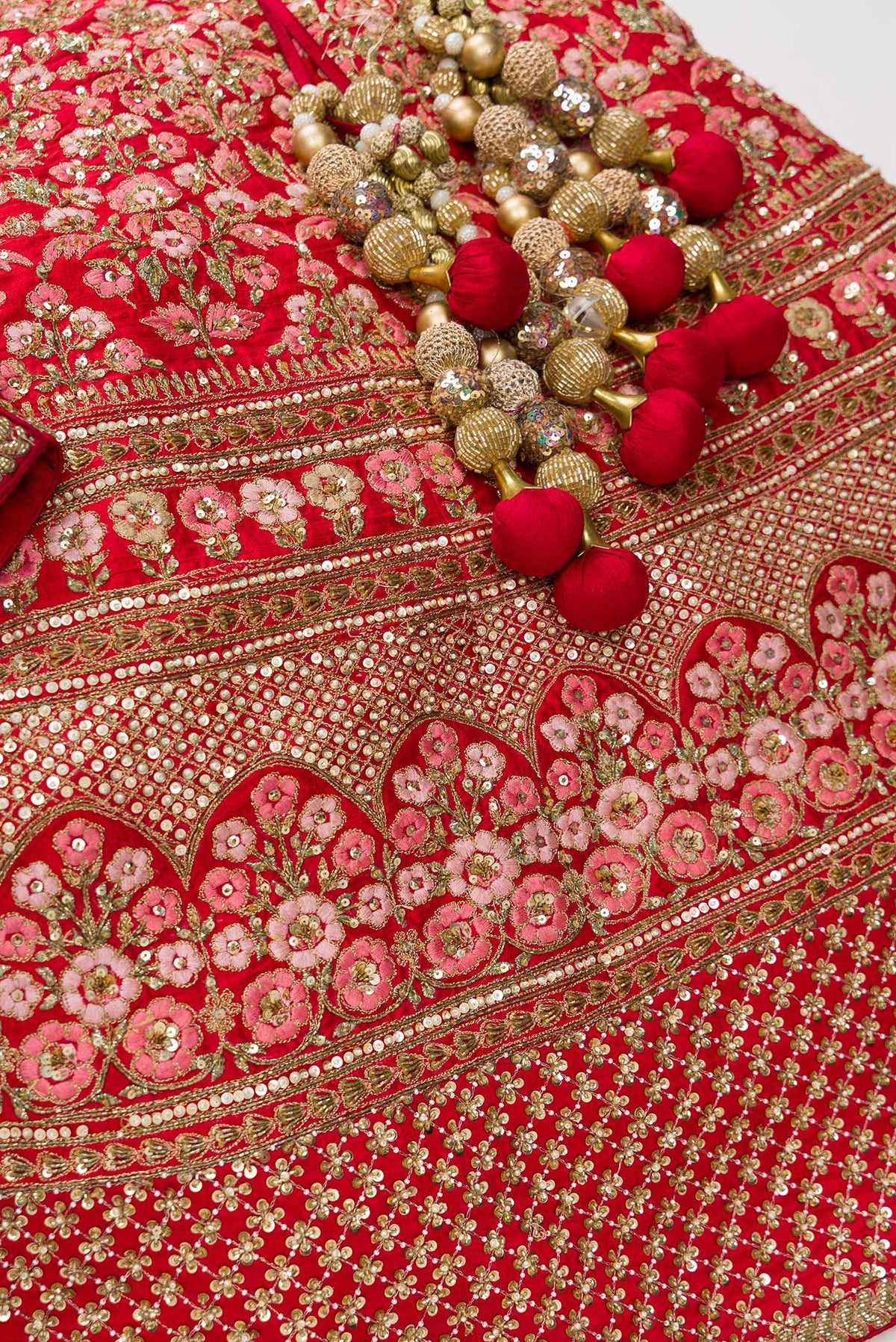 Detailed shot of Red Banarasi Silk Womens Lehenga set featuring Embroidered Choli paired with Red Embroidered Skirt with Embroidered Border and a Embroidered dupatta in Red