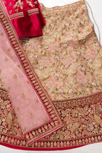 Flat lay of Red Banarasi Raw Silk Womens Lehenga set featuring Embroidered Choli paired with Pink Embroidered Skirt with Embroidered Border and a Embroidered dupatta in Pink
