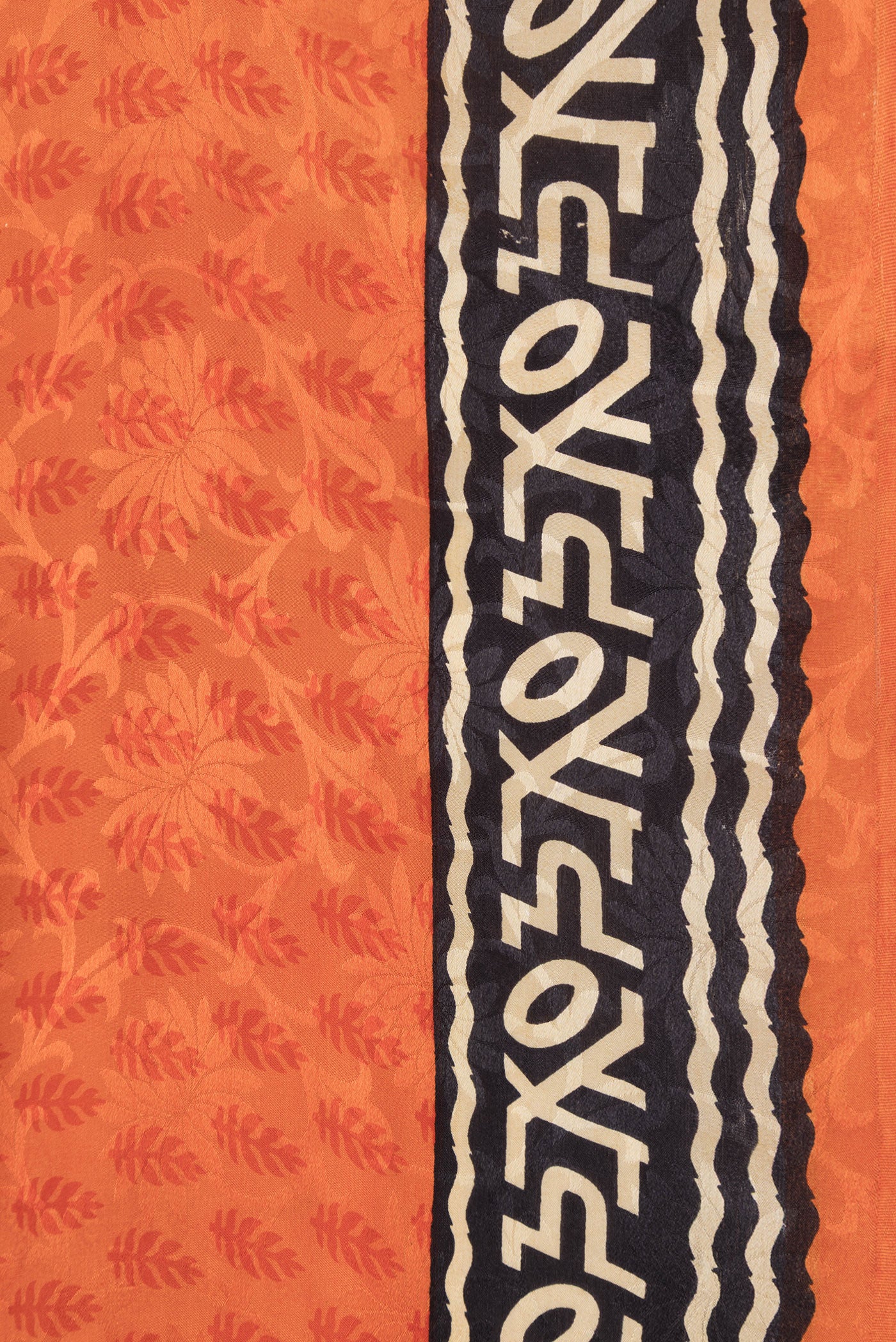 Border image of Orange Dual Tone Mysore Crepe Saree with Printed design on the body and Printed Border. 
