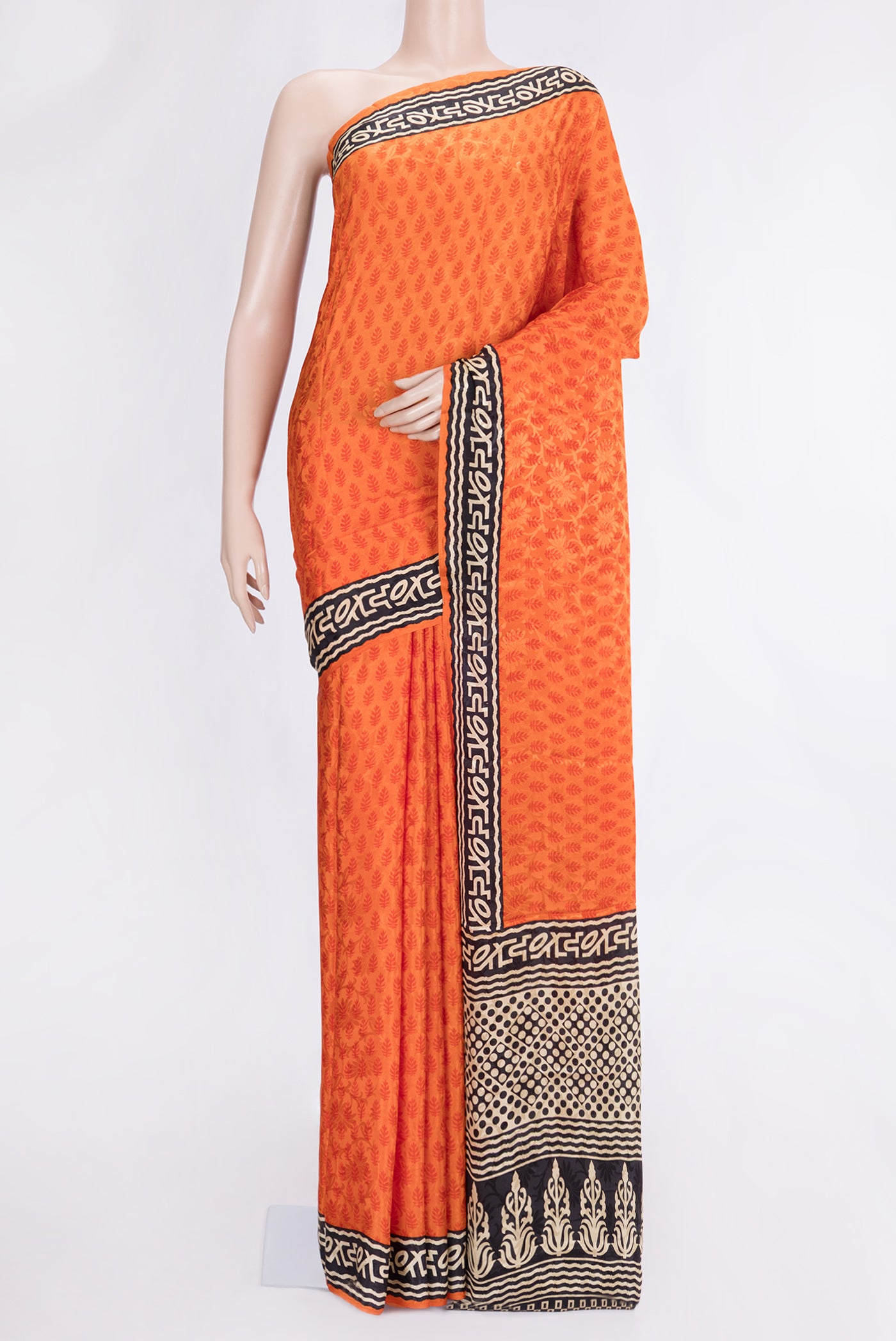 Orange Dual Tone Mysore Crepe Saree with Printed design on the body and Printed Border.  displayed on a mannequin
