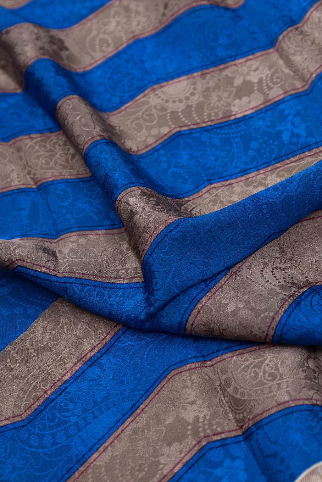 Close up of Pink Dual Tone Mysore Crepe Saree with Printed design on the body and Printed Border.  displaying folds