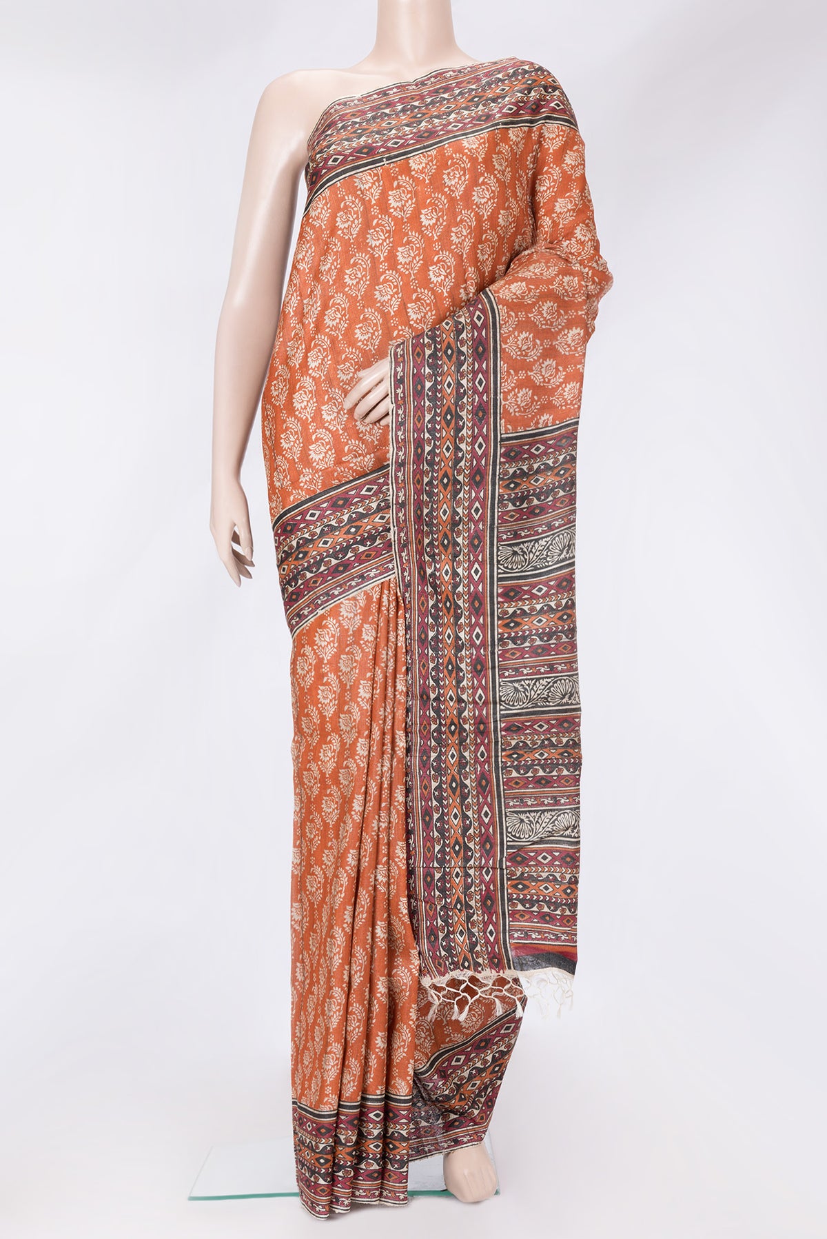 Orange Dual Tone Tussar Silk Saree with Printed design on the body and Printed Border.  displayed on a mannequin