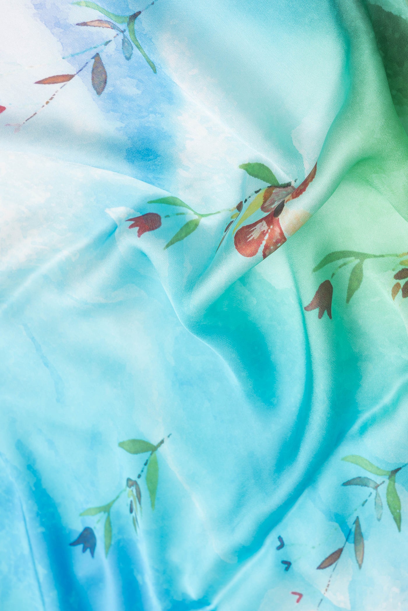 Close up of Sky Blue Dual Tone Mysore Crepe Saree with Printed design on the body and Plain Border.  displaying folds