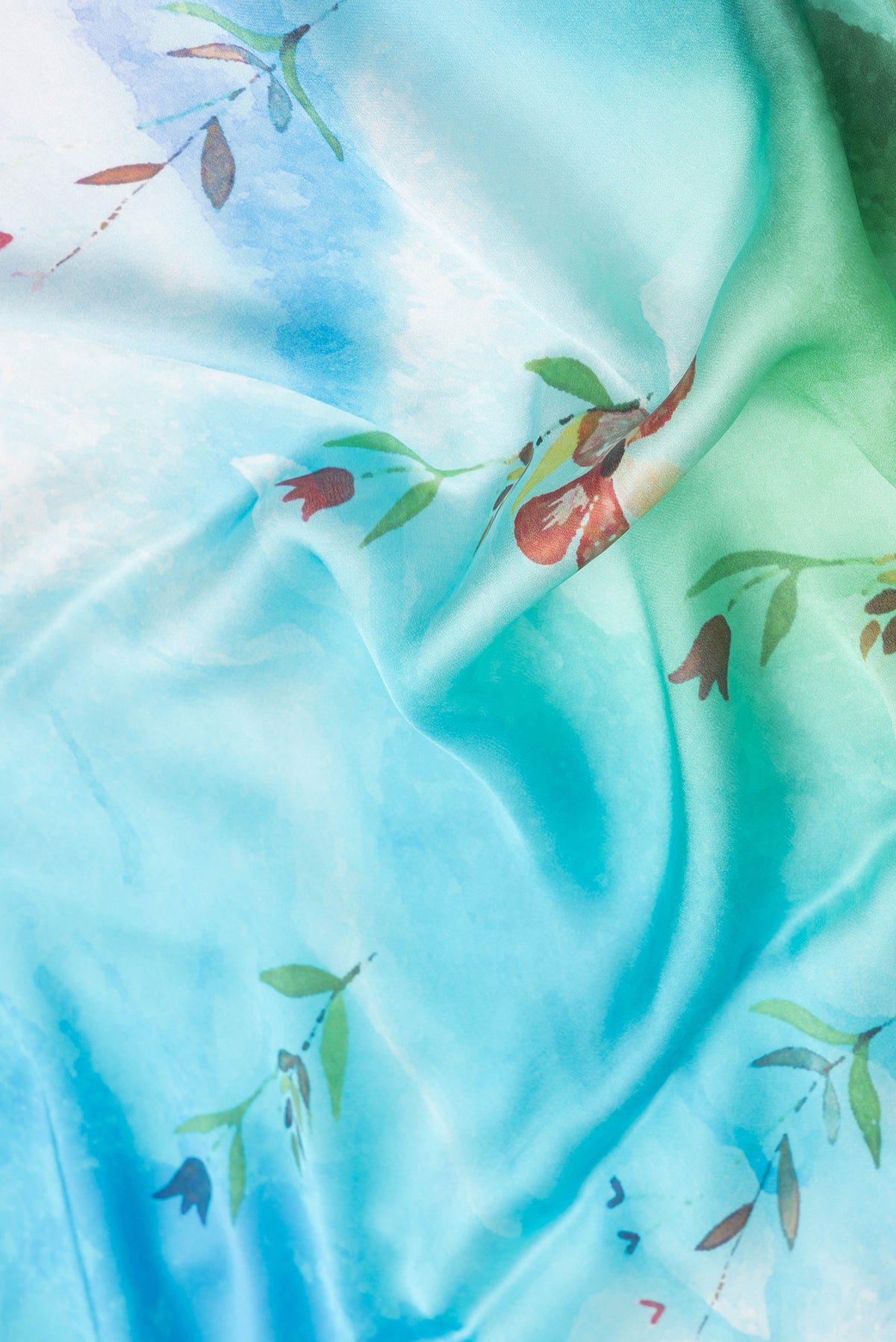 Close up of Sky Blue Dual Tone Mysore Crepe Saree with Printed design on the body and Plain Border.  displaying folds