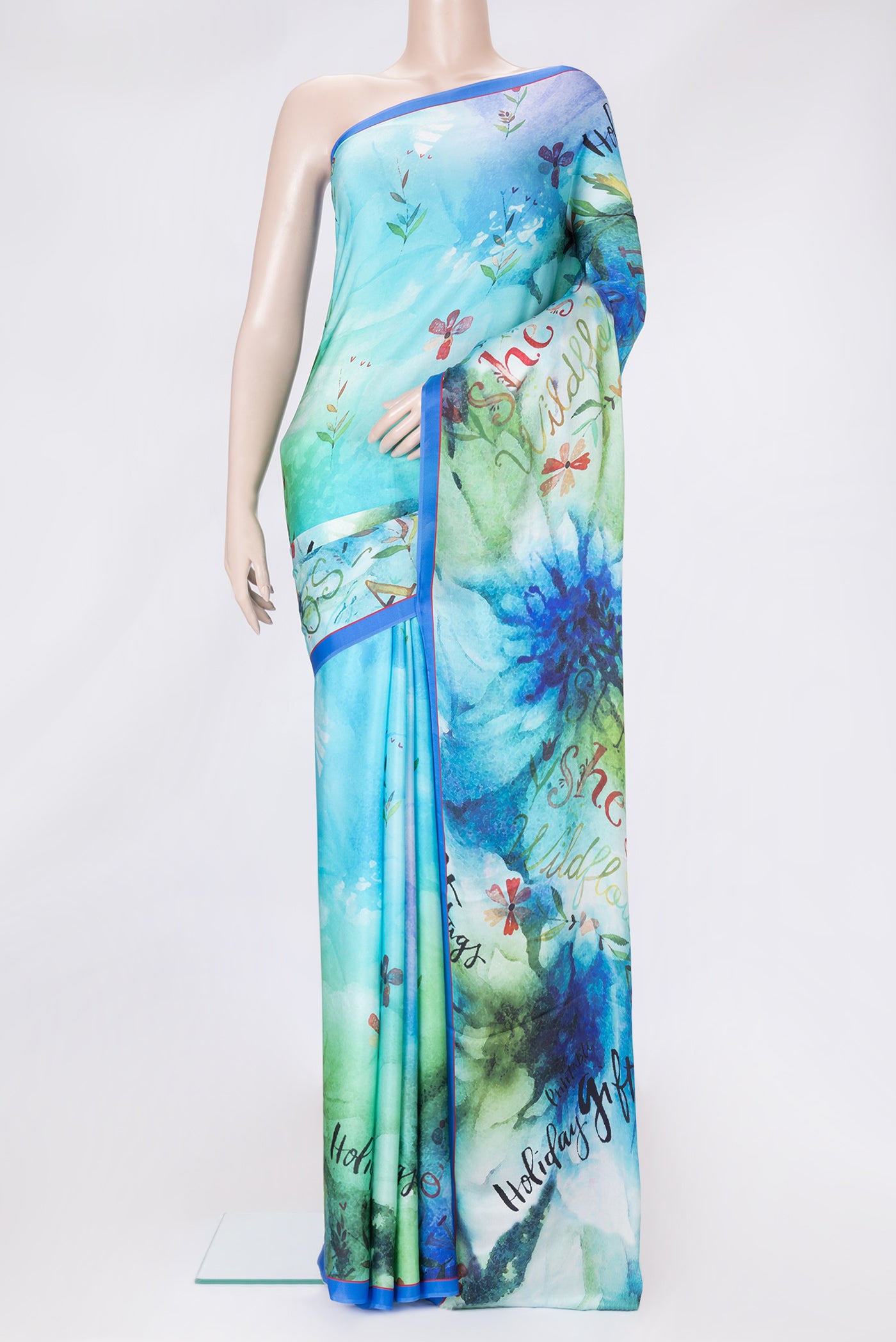 Sky Blue Dual Tone Mysore Crepe Saree with Printed design on the body and Plain Border.  displayed on a mannequin