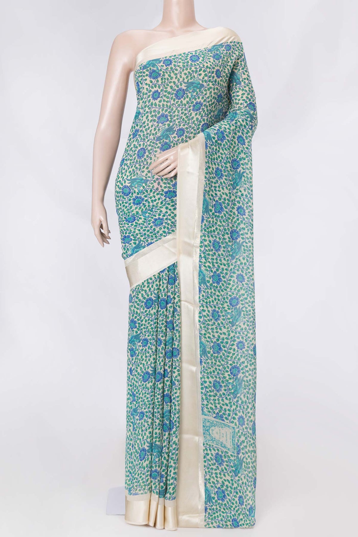 Beige Dual Tone Mysore Crepe Saree with Printed design on the body and Zari Border displayed on a mannequin