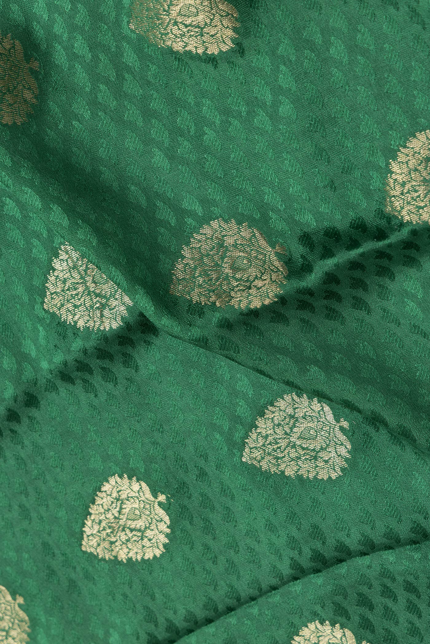 Close up of Bottle Green Dual Tone Georgette Saree with Jacquard With Zari Butta on the body and Zari Border.  displaying folds