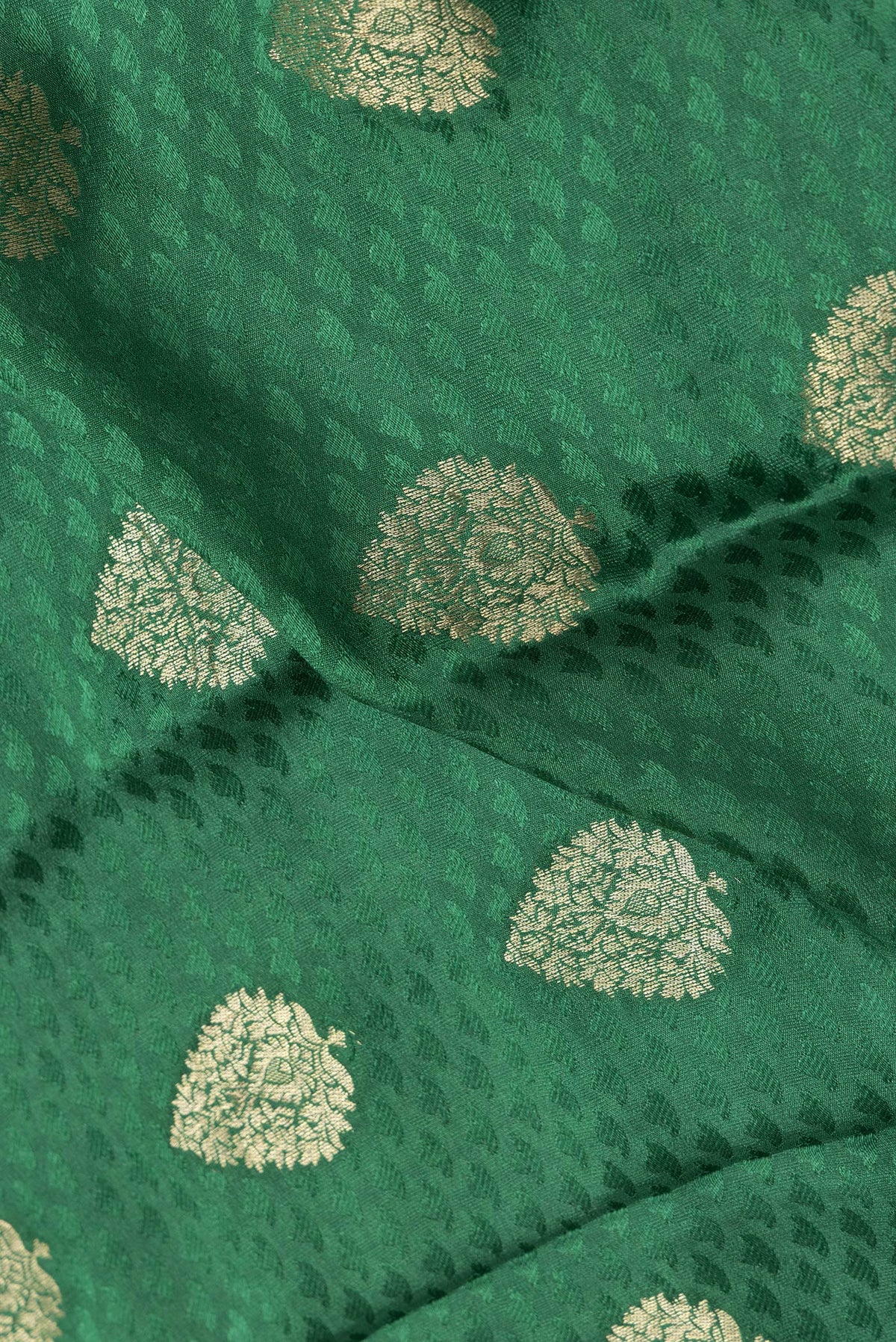 Close up of Bottle Green Dual Tone Georgette Saree with Jacquard With Zari Butta on the body and Zari Border.  displaying folds