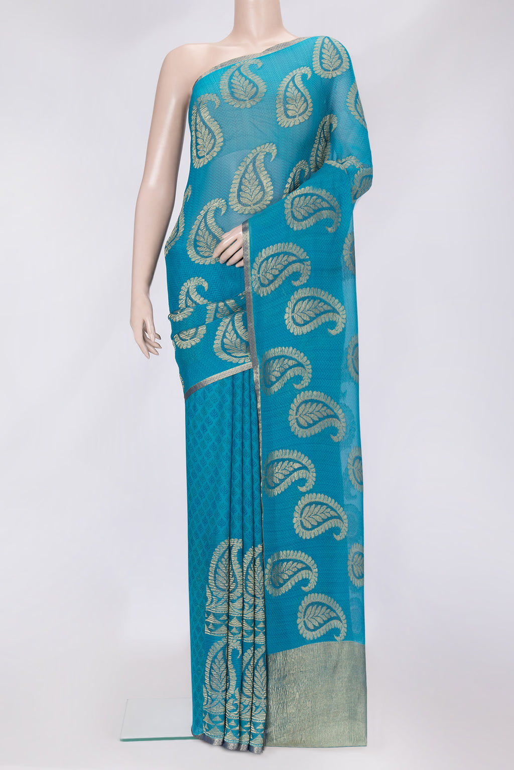 Sky Blue Dual Tone Mysore Georgette Saree with Zari Butta on the body and Zari Border.  displayed on a mannequin